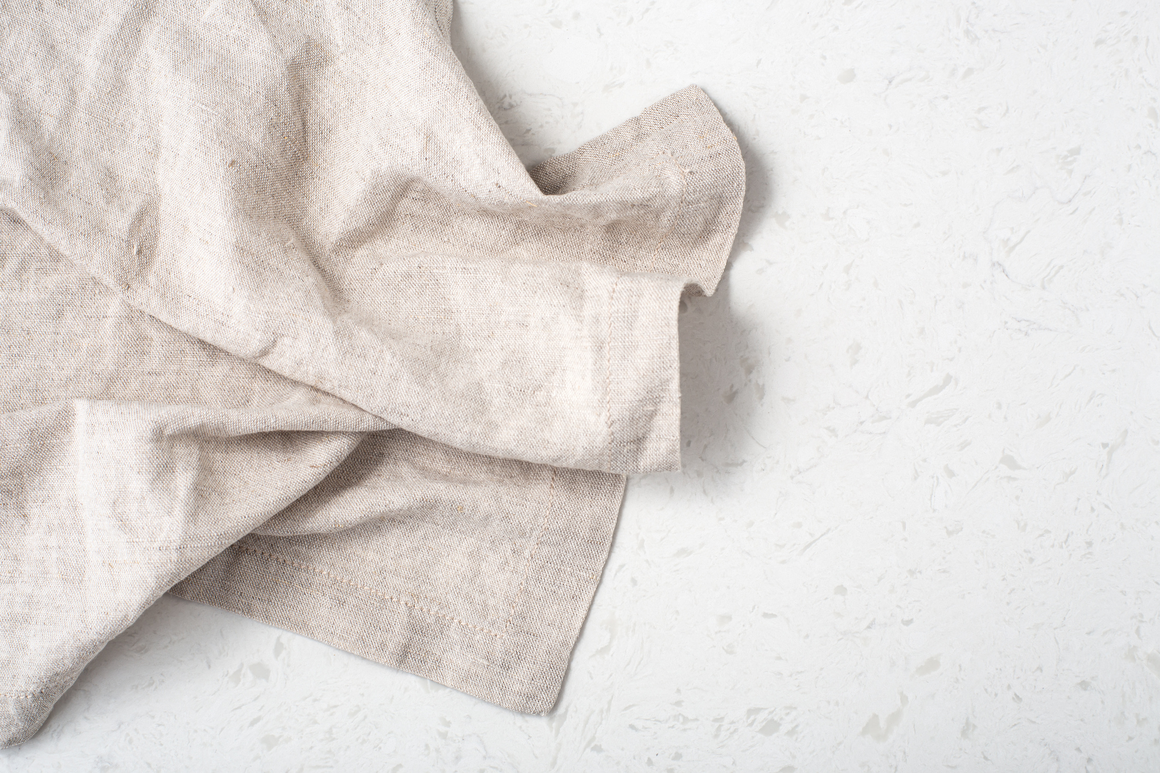 Linen tablecloth on marble kitchen table background